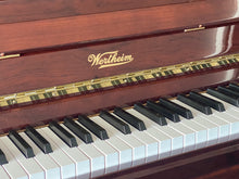 Load image into Gallery viewer, Close-up of a Wertheim piano with visible branding.
