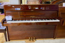 Load image into Gallery viewer, Wooden Yamaha piano in a showroom setting