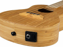 Load image into Gallery viewer, Close-up of a bamboo ukulele with a focus on the sound hole, bridge and amp input.
