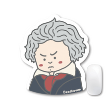 Load image into Gallery viewer, Mousepad with cartoon Beethoven with a sad expression on a white background, and a white mouse .
