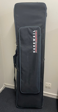 Load image into Gallery viewer, Kurzweil keyboard case on a gray floor against a white wall
