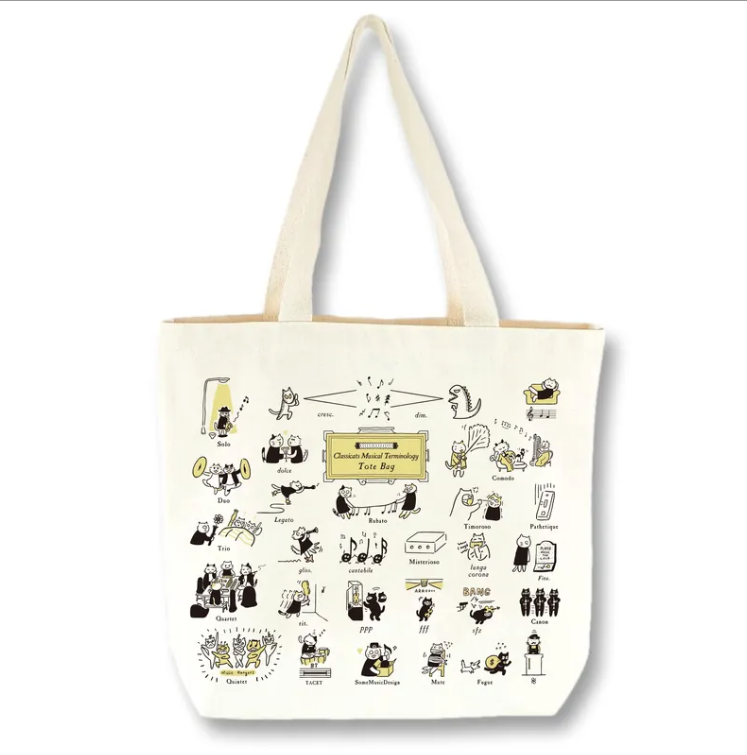 Tote bag with cartoon illustrations of cats doing musical things, on a white background